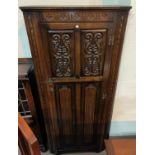 A Jacobean style carved oak hall robe