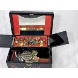 A lacquer jewellery box and a selection of costume jewellery