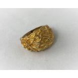 A 9 carat hallmarked gold modernist ring in the form of a cluster of leaves, 6.8 gm size 'J'