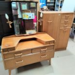 A 1950's light oak 2 piece bedroom suite comprising tallboy with hanging cupboard, small cupboard