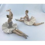 Two large Nao figures of girl ballerinas doing floor exercises