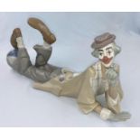 A Lladro figure reclining clown with ball