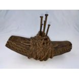 An African tribal carved wood double dog form fetish, applied nails and intertwined rope 25cm