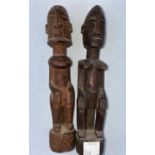 A pair of African tribal carved wood figures, male and female 19cm