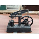 A scale model "nodding donkey" type pump with large fly wheel by Stuart length 35cm