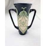 A Moorcroft tapering 2 handled vase decorated in the "Snowdrop" pattern designed by Rachel Bishop