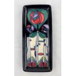 A red Moorcroft pen tray decorated in the Secessionist manner impressed & monogrammed length 20.