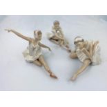 Three Nao figures of girl ballerinas doing floor exercises