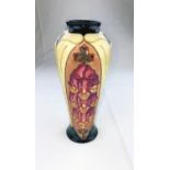 A Moorcroft vase of tapering form decorated in the Foxglove pattern designed by Rachel Bishop