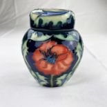 A Moorcroft ginger jar decorated with red poppies impressed height 11cm