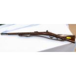 A Belgian breech loading obsolete calibre rifle with rolling loading chamber, stock numbered 873,