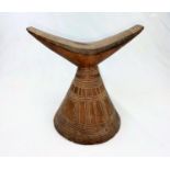 An East African tribal neck rest, Gurage, with conical base having incised geometric decoration 17cm