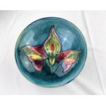 A circular Moorcroft dish decorated with a Lily flower & leaves, signed and impressed diameter 17cm