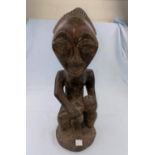 An African tribal carved wood figure of mother and child 36cm