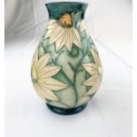 A Moorcroft baluster vase decorated with white star shaped flowers impressed & monogrammed height