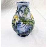 A Moorcroft baluster vase decorated with yellow & white flowers impressed & monogrammed height 13.