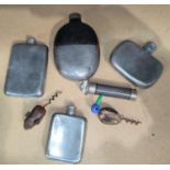 A selection of pewter hip flasks, corkscrews etc