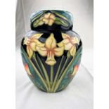 A Moorcroft Carousel pattern ginger jar decorated with daffodils, rosehips & primroses height