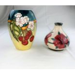 A Moorcroft vase of ovoid form decorated with cherries & white flowers, designed by D.J. Hancock,