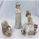 Three Lladro figures - girl in nightcap, Eskimo girl with bear, girl on the telephone (receiver a.