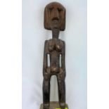 An African tribal (carved) wood female figure, black stained finish, 34cm