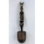An African carved wood ladle with tall figure handle, 47cm