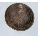 An African tribal rootwood bowl, concentric engraved line decoration, 3 metal stud feet 19 x 18cm