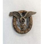 A German World War II Luftwaffe pilots badge with eagle in wreath stamped OM to back of eagle 5cm (