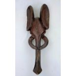 An African tribal carved and stained wood elephant mask 55cm