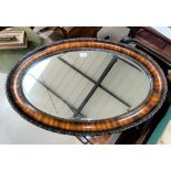 A wood framed oval beveled glass mirror, max 80cm