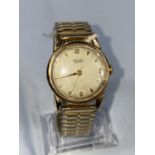 A gents vintage Rotary wristwatch in 9 carat hallmarked gold case, on gold plated expanding strap,