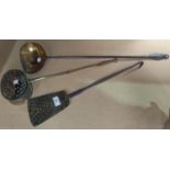 A 19th century cream skimming ladle in brass and wrought iron; a similar slice; an oval chestnut