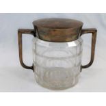 An Art Deco cut glass biscuit barrel with twin silver plated handles, lid and collar, height 15.5cm