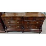 A Victorian figured mahogany serpentine front, 6 drawer sideboard with brass drop handles & turned