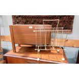 A mid century teak magazine rack; a vintage atom style magazine rack