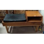 A 1960's teak telephone/hall seat