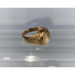 A gentleman's yellow metal monogrammed signet ring with bark effect shoulders. Stamped 585. 5.9g