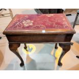 A Regency period pair of dining chairs in stained rosewood, with brass rosettes to the top rails, on