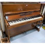 A modern upright piano with iron frame in sapele case "Salk" by W H Barnes, London, with stool