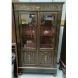 A 19th century French Empire style ebonized side cabinet with classical motif brass inlay to the