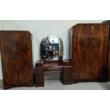 An Art Deco figured walnut 3 piece bedroom suite comprising double wardrobe, gent's fitted