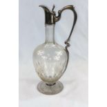 An Art Nouveau period continental cut claret jug with elongated white metal handle, rim & lid;