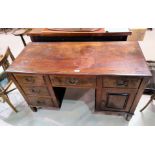 An Edwardian walnut kneehole desk with 7 drawers; a reproduction mahogany 3 height bookcase