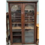 A Victorian mahogany display cabinet enclosed by 2 arched glazed doors, height 169 cm, width 106 cm;
