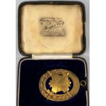 A 19th century masonic jewel in gilt metal and blue enamel, in original box