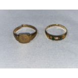 An 18 carat hallmarked gold ring set with 2 green stones, 1.4 gm (3 stones missing); a yellow