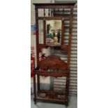 A 1930's oak mirror back hallstand; an oak 2 tier trolley/table; a 1930's wall mirror in canted