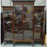 An early 20th century Georgian style display cabinet with 4 astragal glazed doors and moulded