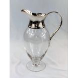 A hallmarked silver and glass large wine carafe by Mappin & Webb, with fitted handle and wide spout,