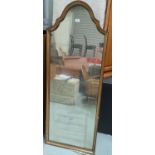 A period style wall mirror in arch top parcel gilt frame; a Persian design rug with blue ground